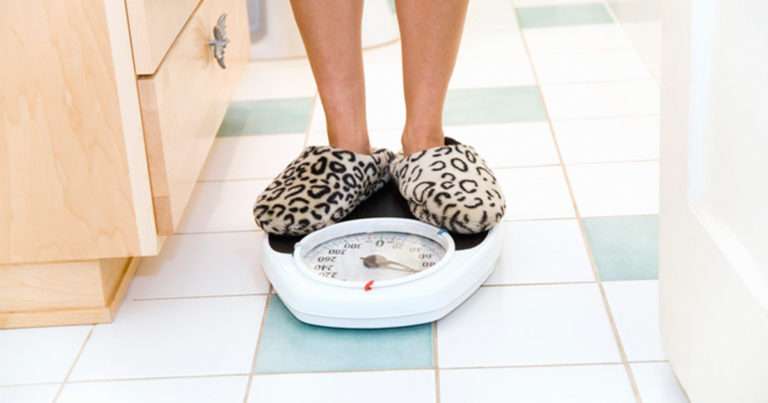Lady weighing herself