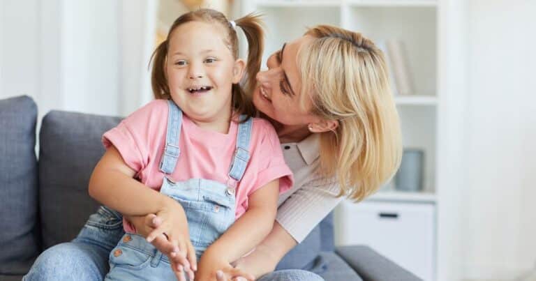 love for a child - mum and daughter cuddling